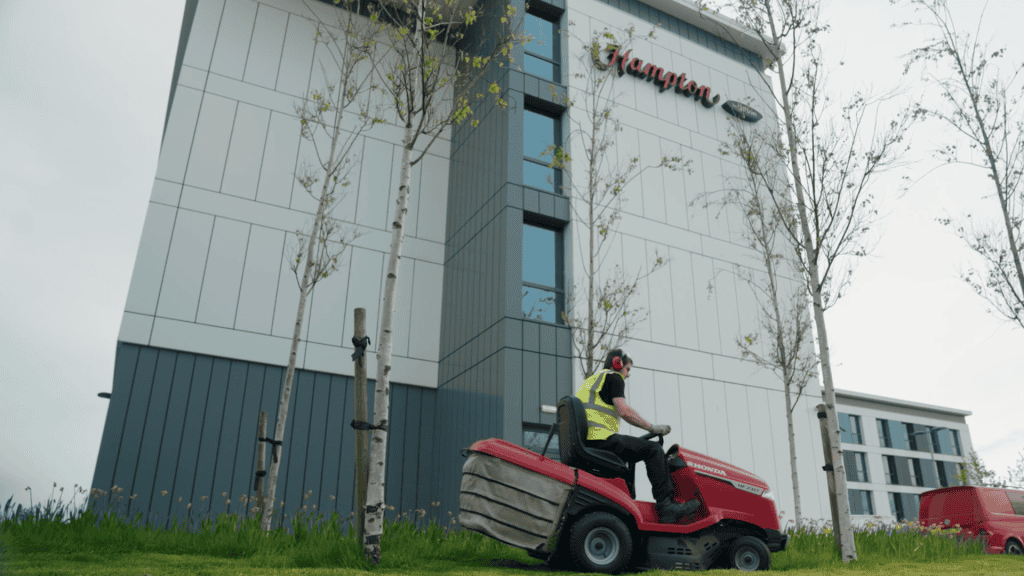 gardening outside Hampton building Aberdeen
